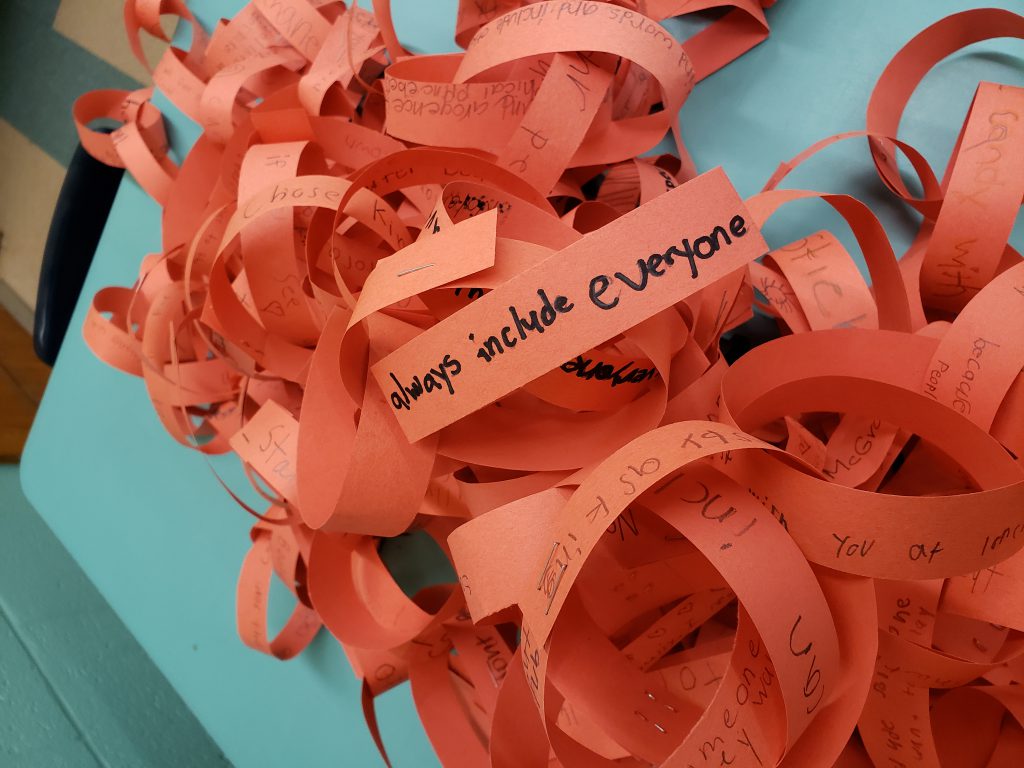 orange paper chains with anti-bullying messages on them