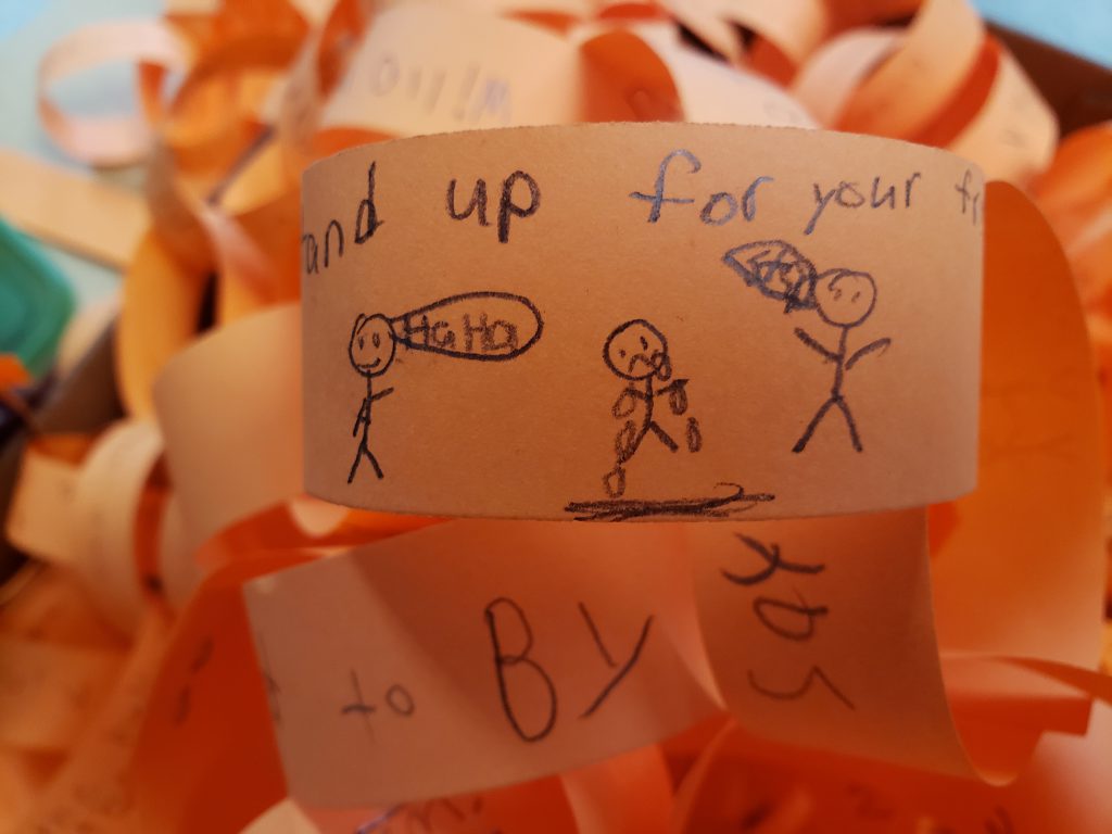 orange paper chains showing anti-bullyin messages