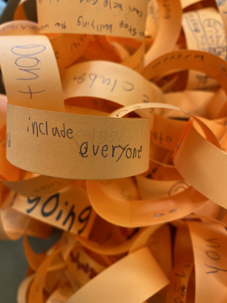 orange paper chains with anti-bullying messages on them