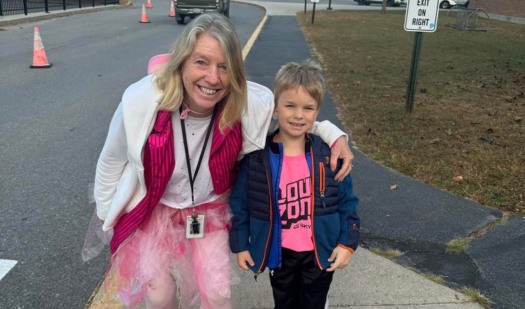 Teacher with student on Pink Out Day at Kensington Road School