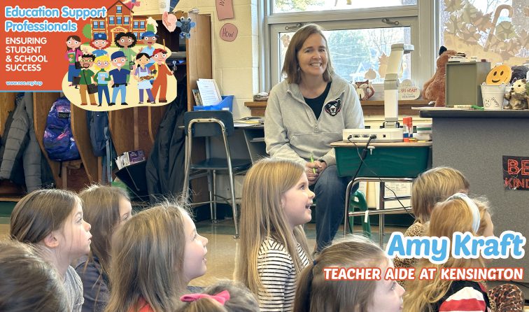 Mrs. Kraft smiling with students as they brainstorm words with the letter A