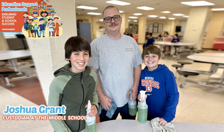 Custodian smiling with students in the cafeteria of hte middle school