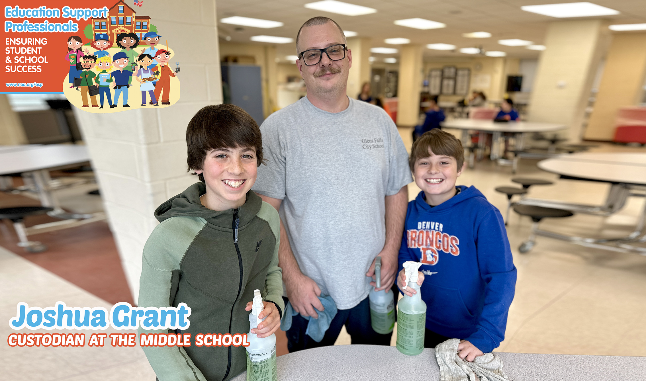 Custodian smiling with students in the cafeteria of hte middle school